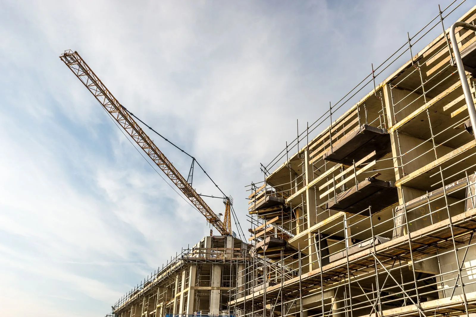 A construction site with crane and scaffolding