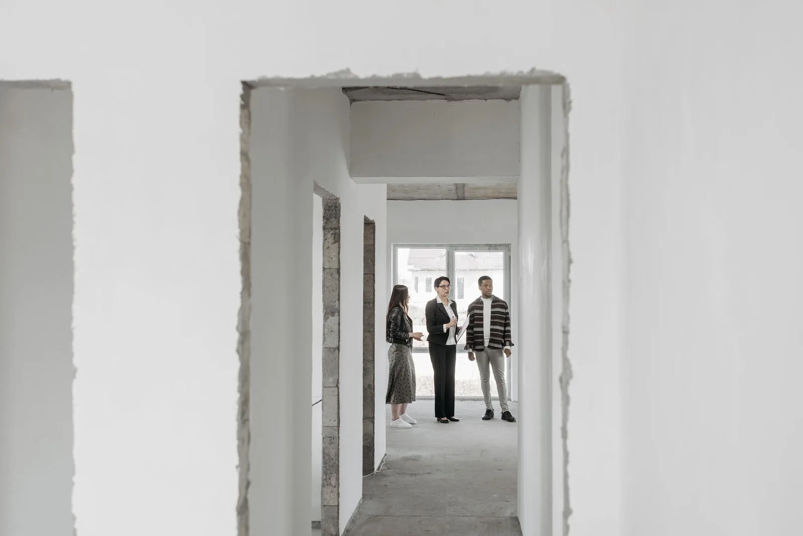 Real estate agent presenting a house to potential buyers